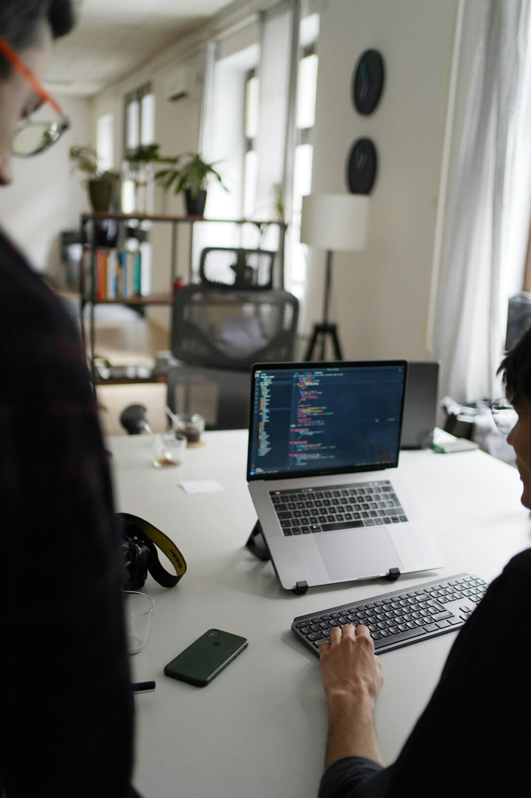 person coding at desk